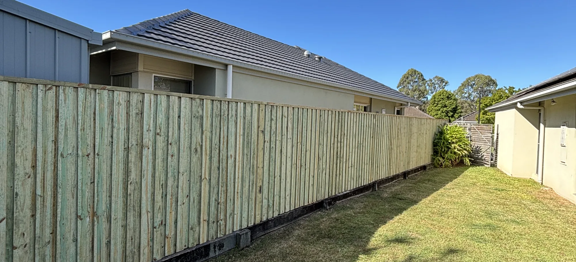 New timber paling fence along a side boundary