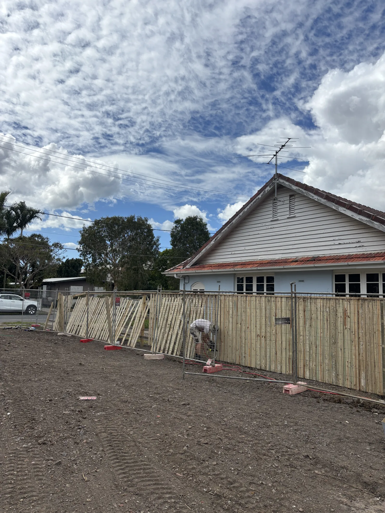 Pro-Form crew building a new timber paling fence along a front boundary