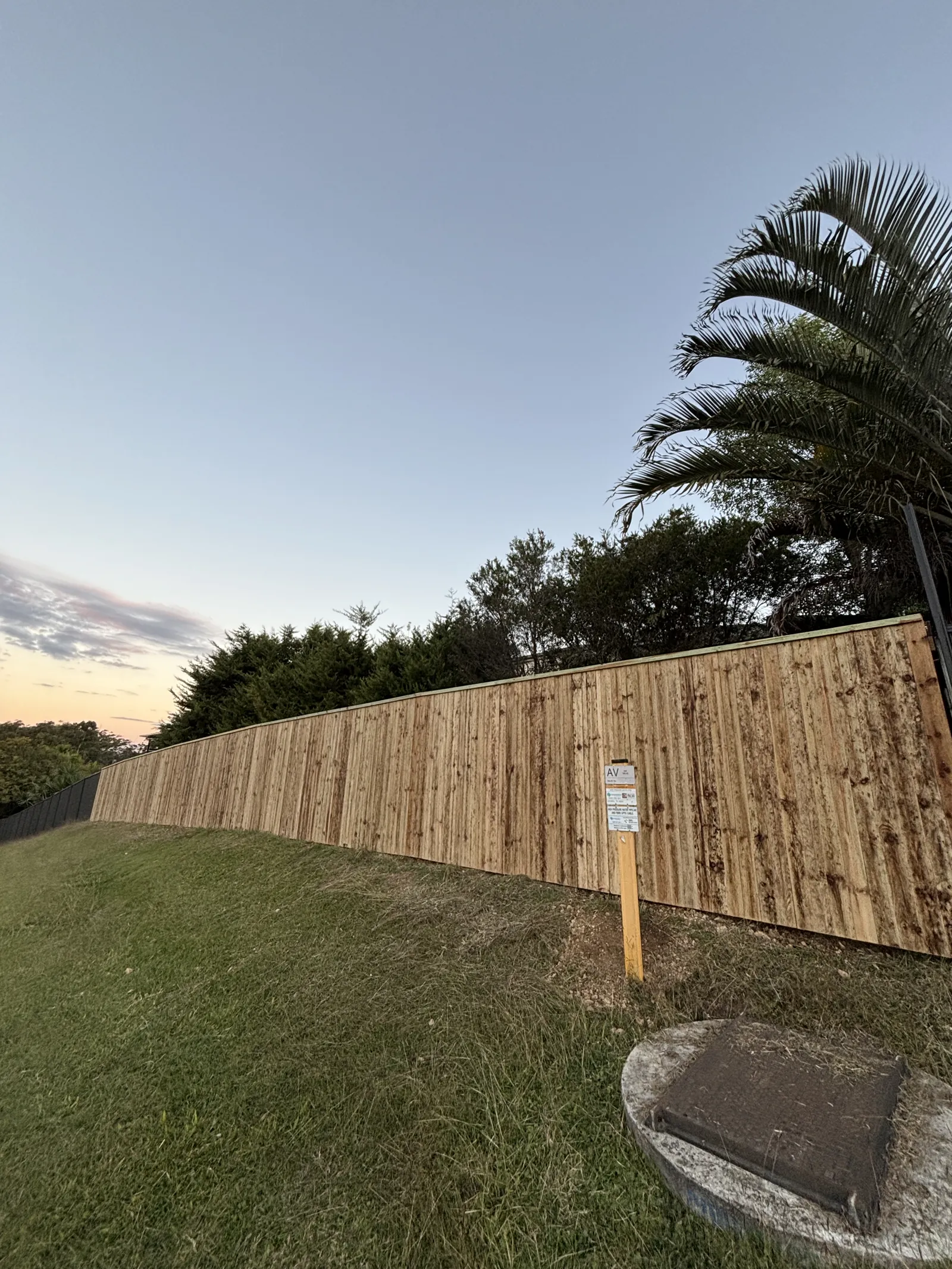 Paling fence at sunset