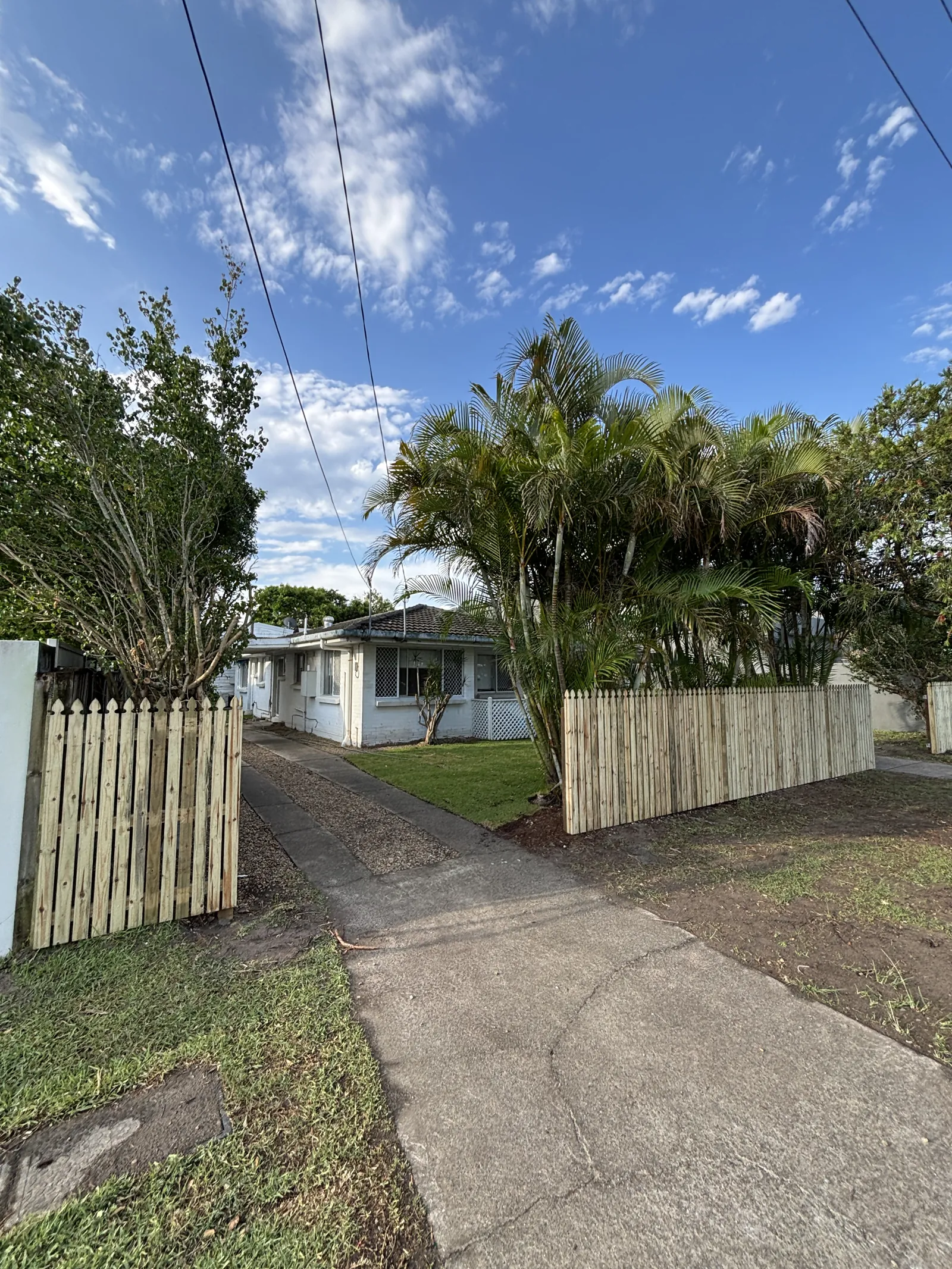Picket fence and gate at a front yard