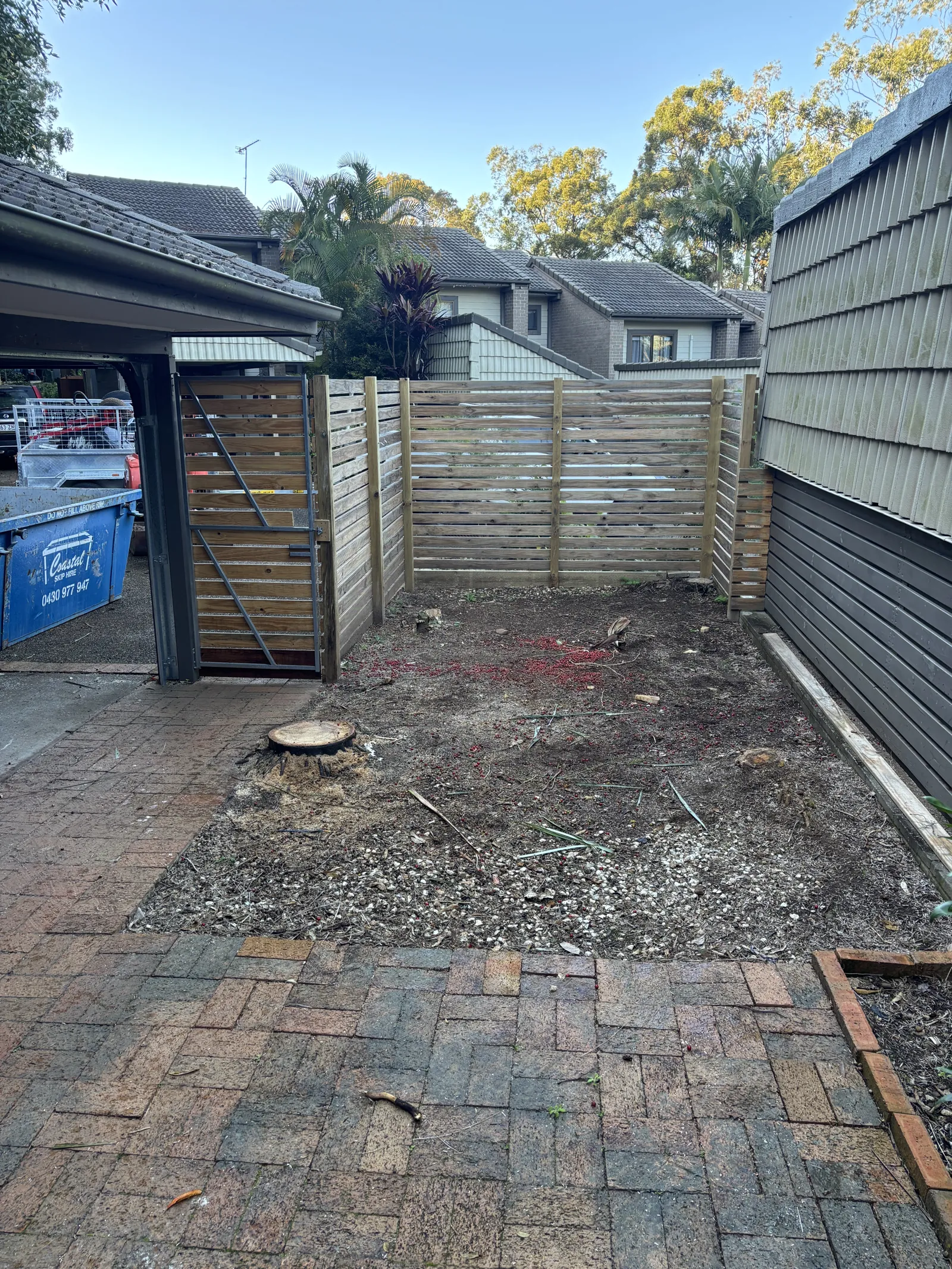 Horizontal timber slat screen fence in a courtyard