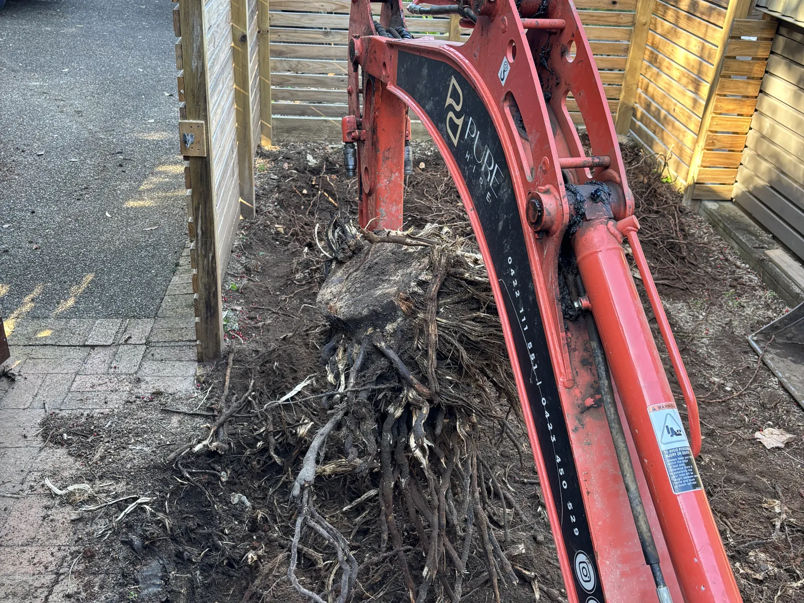Stump removal with the mini excavator