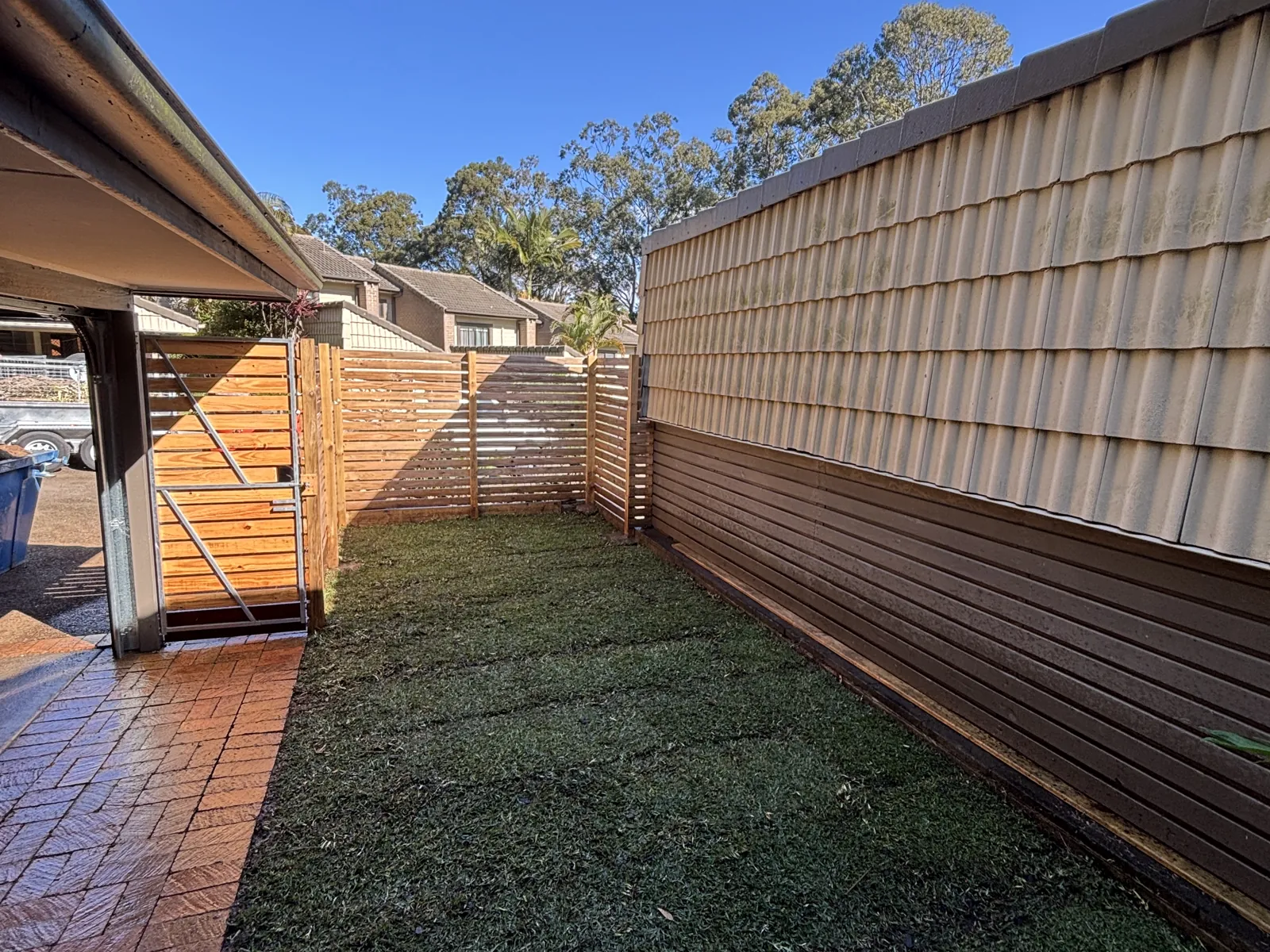 Courtyard with turf and slat screen