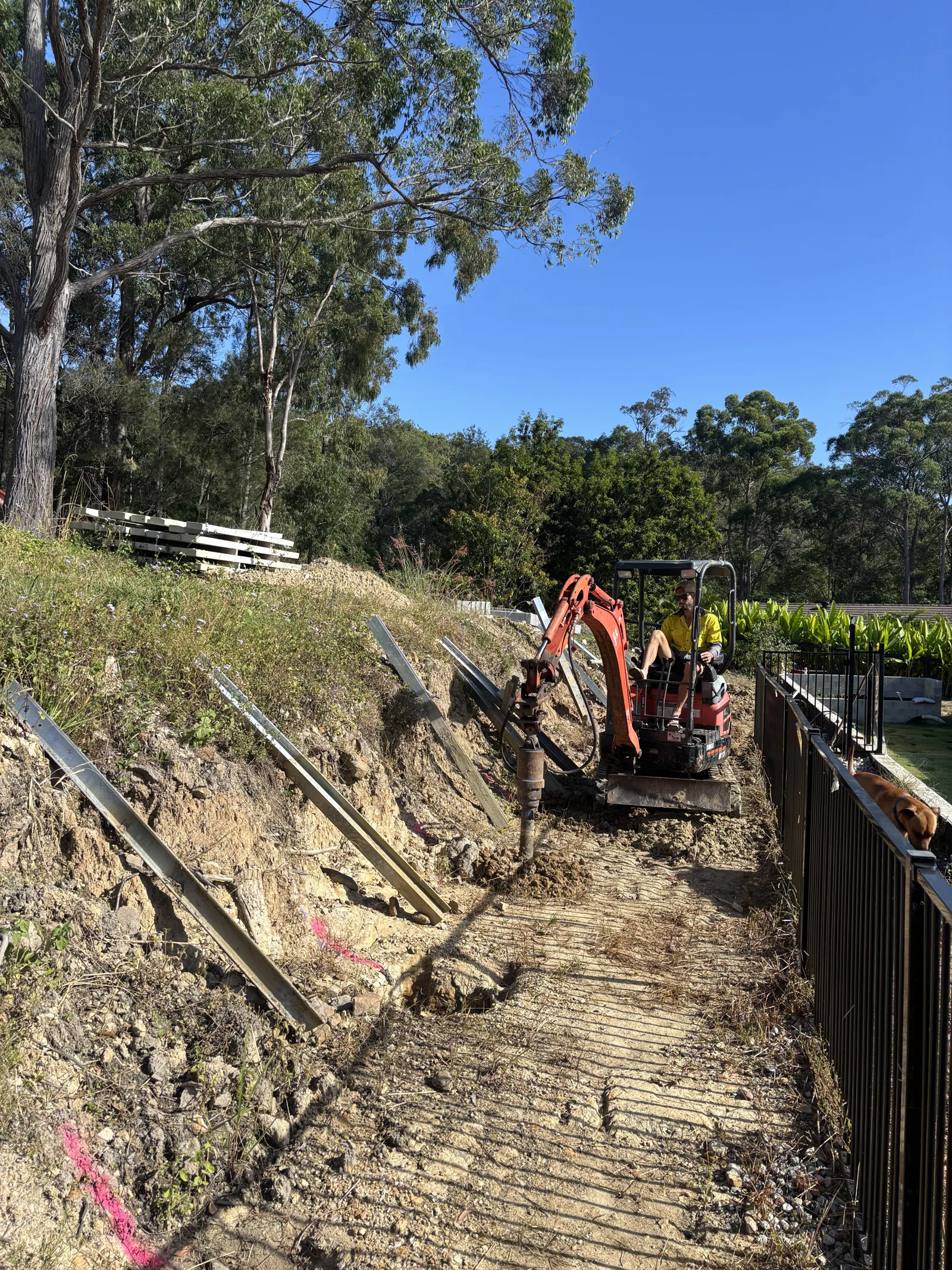 Setting retaining wall posts on a slope