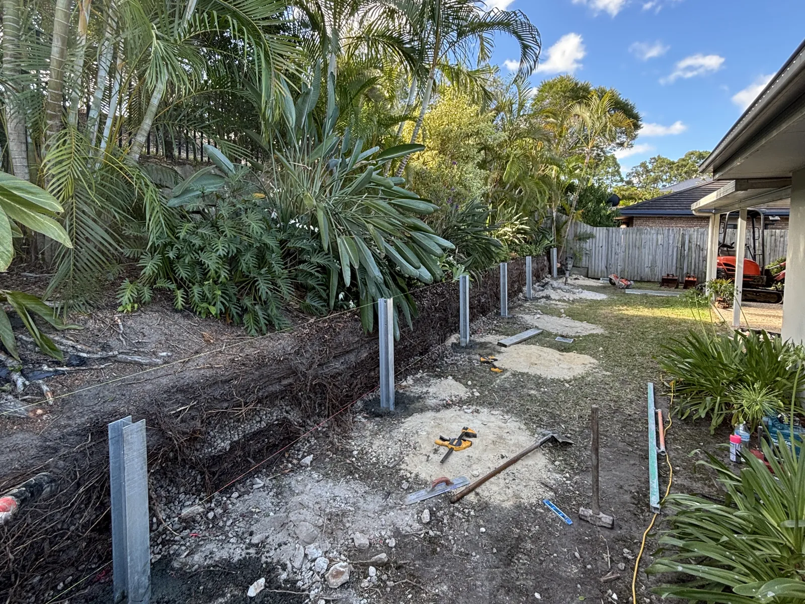 New galvanised posts set for a wall